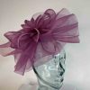 Crin fascinator with feather flower in fuschine