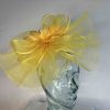 Crin fascinator with feather flower in mustard sun