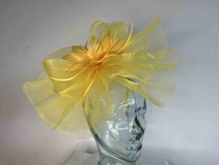 Crin fascinator with feather flower in mustard sun