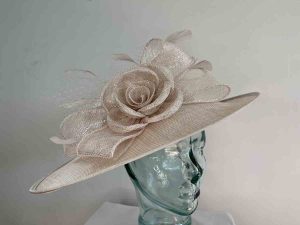 Large sinamay hatinator with sinamay rose in champagne lurex