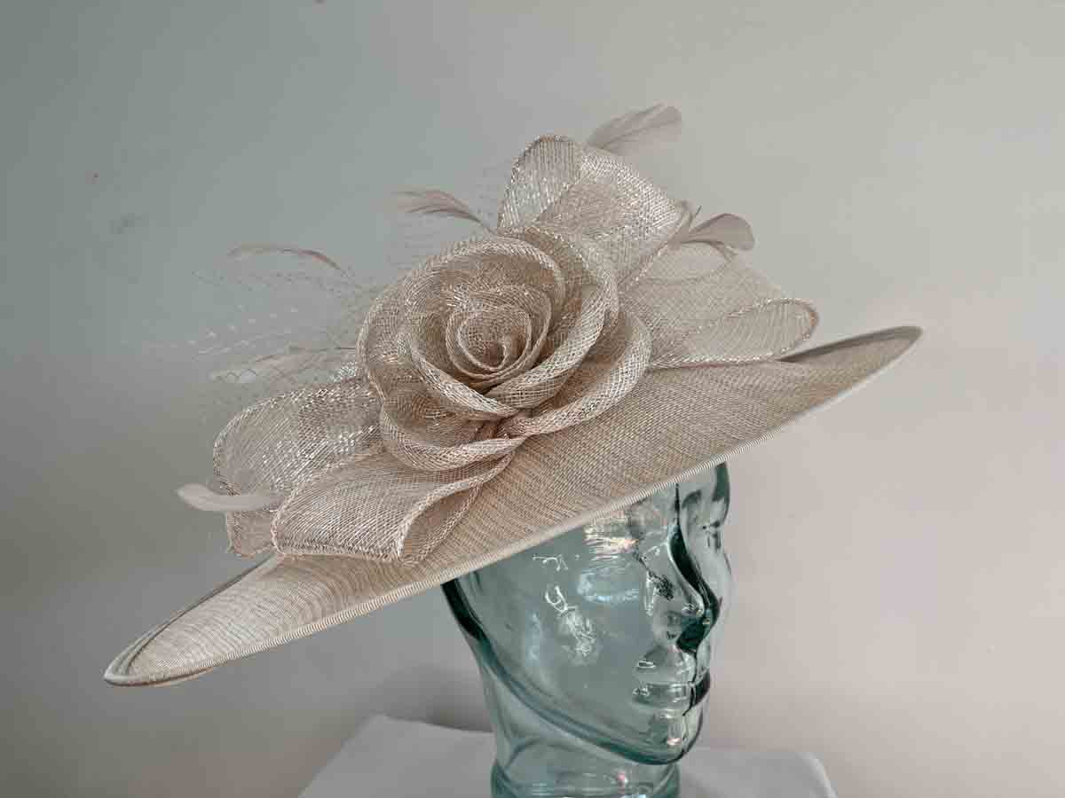 Large sinamay hatinator with sinamay rose in champagne lurex
