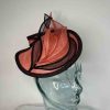 Small sinamay hatinator in tangerine and black