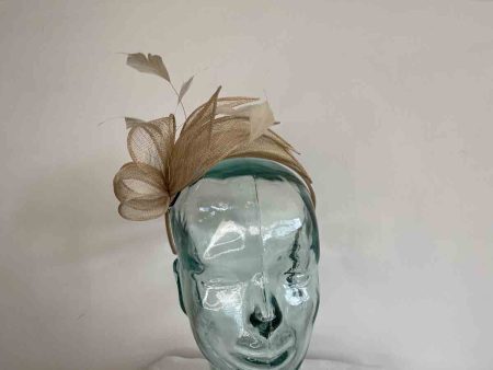 Fascinator with leaves in champagne