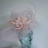 Pleated crin fascinator with feathered flowers in baby pink