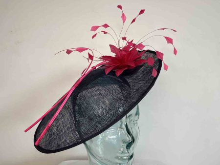 Elegant hatinator with feathered flower in navy and hot pink