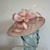 Sinamay hatinator with feathered flower in chalk pink