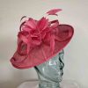 Sinamay hatinator with feathered flower in raspberry pink
