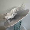Silver hatinator with large white silk flower
