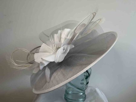 Silver hatinator with large white silk flower