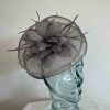 Sinamay fascinator with feathered flower in demin