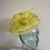 Sinamay fascinator with feathered flower in zest