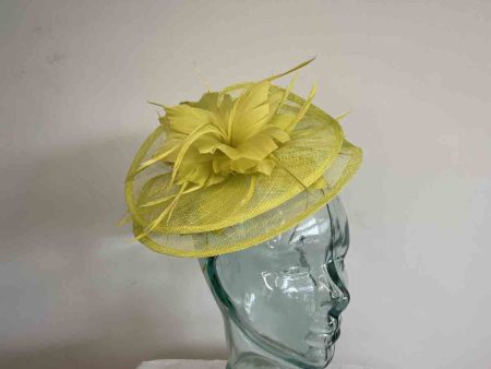 Sinamay fascinator with feathered flower in zest