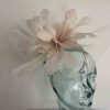 Crin fascinator with feathered flower in fizz gold
