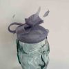 Pillbox fascinator with bow in viola