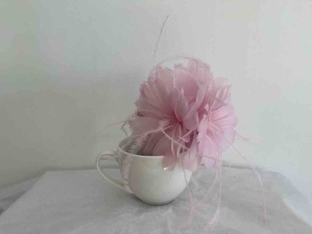 Feathered flower fascinator in peony