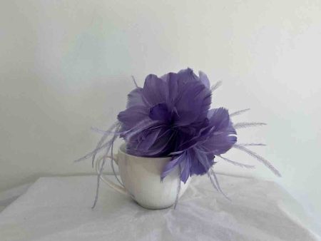 Feathered flower fascinator in viola