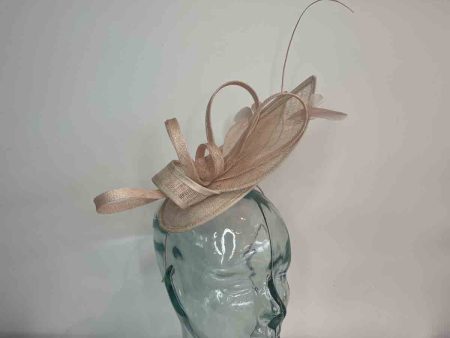 Cocktail fascinator with large sinamay leaves in blush