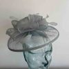 Sinamay fascinator with feathers in light spruce