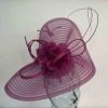 Pleated crin fascinator with feathered flowers in magenta pink