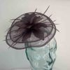 Sinamay fascinator with feathered flower in abuergine
