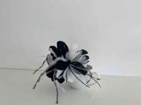 Feathered flower fascinator in black and white