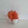 Feathered flower fascinator in persimmon