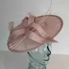 Circular hatinator with open flower in oyster