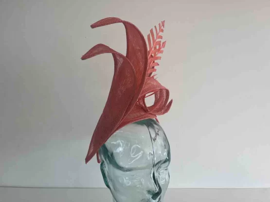 Dramatic fascinator with arrow head feathers in tangerine