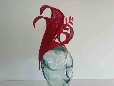 Dramatic fascinator with arrow head feathers in tulip red