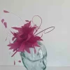 Feather fascinator in berry