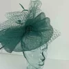 Sinamay fascinator with netting in emerald