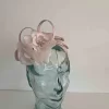 Triple leaf fascinator with flower in oyster