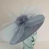 Oval hatinator with crin and feathered flower in baby blue