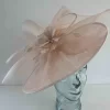 Oval hatinator with crin and feathered flower in linen