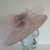 Oval hatinator with crin and feathered flower in orchid