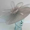 Oval hatinator with crin and feathered flower in silver
