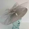 Oval hatinator with crin and feathered flower in silver lurex