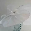 Oval hatinator with crin and feathered flower in white