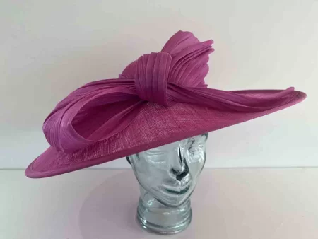 Large oval hatinator with large abaca bow in magenta