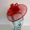 Sinamay fascinator with feathered flower in burnt orange