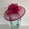 Sinamay fascinator with feathered flower in hot pink