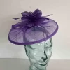 Sinamay fascinator with feathered flower in thistle
