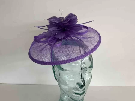 Sinamay fascinator with feathered flower in thistle