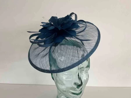Sinamay fascinator with feathered flower in teal