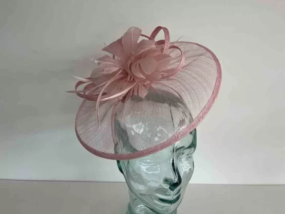 Sinamay fascinator with feathered flower in wildrose