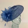 Oval hatinator with large feathered flower in cornflower